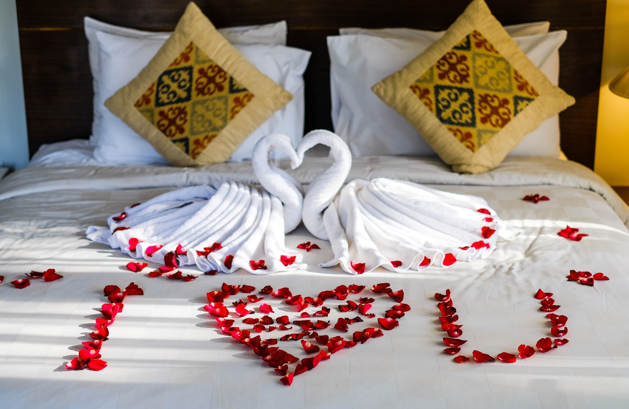 Decorated towels on the hotel bed, hotel room